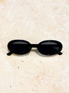 Annalise Oval Sunglasses.- Black